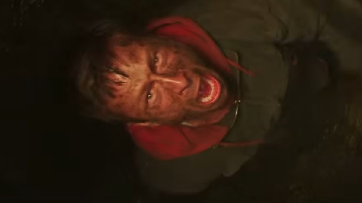 image of glen powell falling down a dark chute in the running man trailer